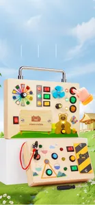 Detail of wooden busy board toy showing LED switches and interactive power control knobs