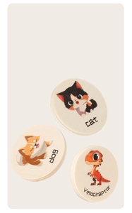 Close-up of circular wooden tiles featuring cartoon cat, dog, and dinosaur with English text