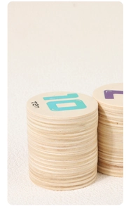 Close-up of circular wooden number tiles featuring blue 10 and ten word for early education
