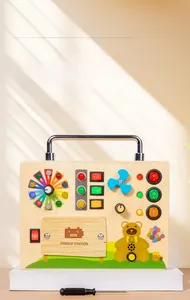 Detailed close-up of a wooden busy board featuring LED lights, fan, and metal toggle switches