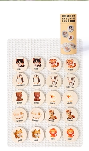 Flat lay of 20 wooden animal matching tiles with storage container on white textured cloth