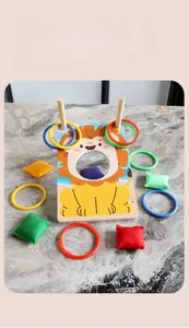 Detail of wooden lion base with colorful rings and bean bags for kids coordination