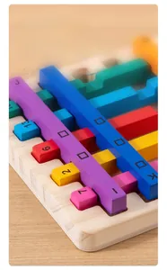 Close-up of smooth wooden sticks with printed numbers and letters for color matching