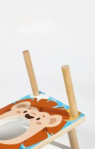 Close-up of the sturdy wooden stand and colorful lion print on children's toss game