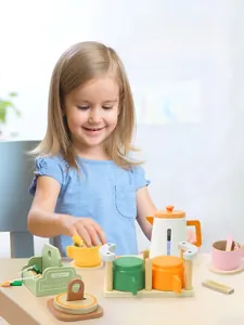Close-up of wooden pretend play tea set featuring colorful cups and an organic tea pot