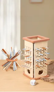 Macro detail of wooden educational game tower with colorful sticks and dice for toddlers