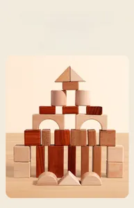 Macro shot of assorted natural wood building blocks stacked in a castle shape on a table