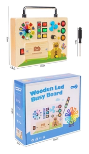 Detail of wooden LED busy board with power buttons, lights and screw driver tool set