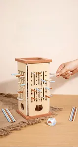 Wooden tower board game detail showing multi-colored sticks and hands playing for focus training