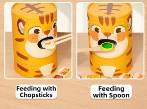 Detail showing toddler fine motor training with wooden spoon and chopsticks for feeding game