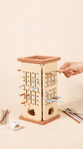 Close-up of wooden educational game frame with colorful sticks for fine motor training