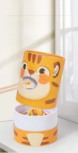 Detailed close-up of tiger-themed wooden feeding toy for fine motor skill training