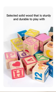 Close-up of wooden alphabet blocks with numbers and animal illustrations for early learning