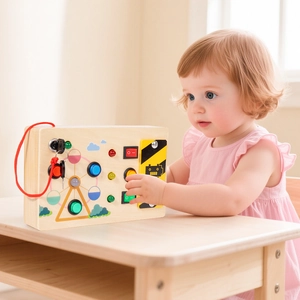 Educational wooden busy board toy for toddlers featuring LED lights and interactive buttons