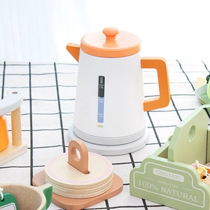 Wooden play kitchen tea set featuring a toy electric kettle with realistic water scale markings