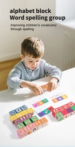 Close-up of a child playing with colorful wooden alphabet blocks and matching cards