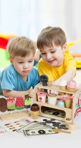 Detailed view of children playing with a wooden ice cream shop toy set and accessories