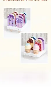 Detail of wooden ice cream play set with colorful popsicles and cones on a display stand