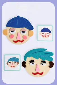 Felt face puzzle toy showing DIY facial expression parts with reference cards
