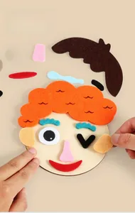 Close-up of kids DIY felt face puzzle showing creative facial features and manual building