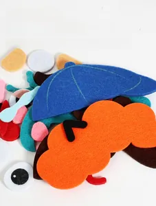 Detail showing colorful felt patches in various geometric shapes for DIY early education toys