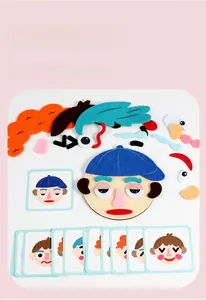 Educational felt face puzzle with various facial features and expression reference cards