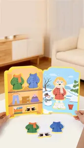 Detail of baby quiet book showing winter clothing puzzle pieces and Velcro wardrobe scene