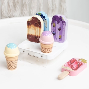 Nordic wooden ice cream shop playset with cones and scoops on a white display stand