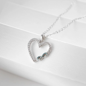 Sparkling S925 sterling silver heart infinity necklace with cubic zirconia and teal enamel