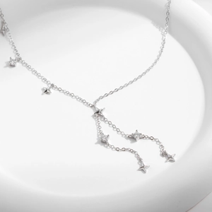 Elegant s925 silver Y-shaped tassel necklace with star charm and zirconia on white tray