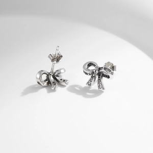 S925 sterling silver bow knot stud earrings with sparkling diamonds and vintage hollow design