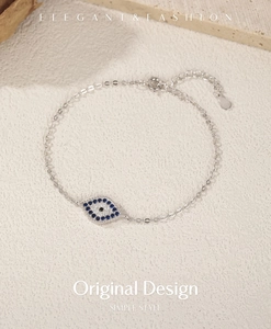 Detail of S925 silver evil eye bracelet with blue zircons and lobster clasp closure