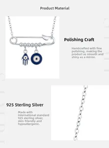 Detail of S925 silver paperclip necklace with blue Hamsa hand and Evil Eye charm