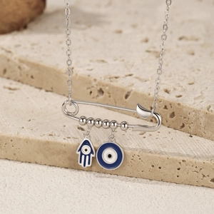 S925 sterling silver safety pin necklace featuring Hamsa Hand and Evil Eye charms