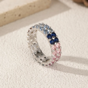 Elegant S925 sterling silver double row ring with blue and pink gemstones on stone background