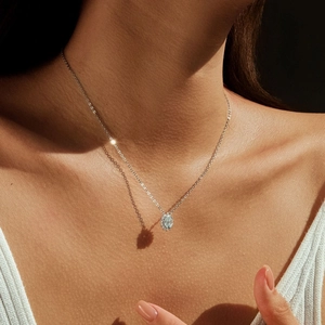 Sparkling 1 carat moissanite flower necklace in S925 silver on female model's neck