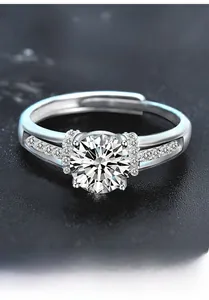 Macro detail of S925 sterling silver four-claw moissanite ring with side accent diamonds