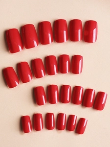 Detailed flat lay of 24 pieces set of glossy red mid-length square press-on nails