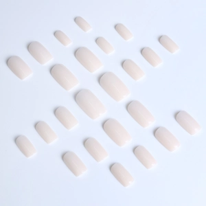 Detailed flat lay of medium square milky white jelly press-on nails in various sizes