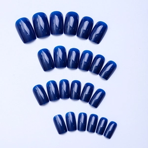 Set of 24 pieces glossy deep blue medium square press-on nails on a white background