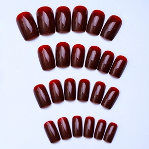 Macro detail of 24pcs glossy burgundy ombre square press-on nails set with gradient finish