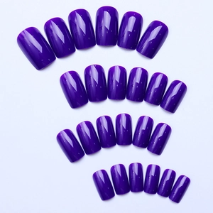 Macro display of 24 dark purple square nails with high-gloss finish and smooth texture
