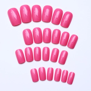 Flat lay of medium-length square hot pink press-on nails with a glossy finish
