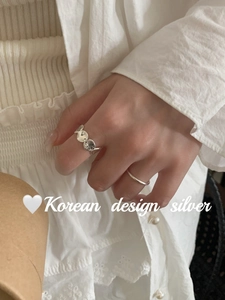 Detail of silver rings set with vintage oval texture and Korean minimalist design