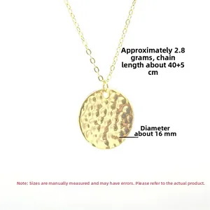 Detailed view of hammered texture round pendant in gold finish with 40+5cm chain