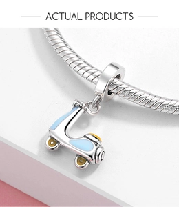 Close-up of S925 sterling silver retro scooter charm with blue and yellow enamel details