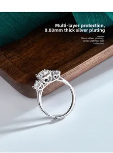 Detail view of S925 sterling silver ring with triple moissanite stones and heart cutouts