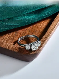 Detailed close-up of S925 sterling silver three-stone moissanite ring with adjustable band