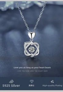 Detailed close-up of S925 sterling silver heart pendant with dancing moissanite stone