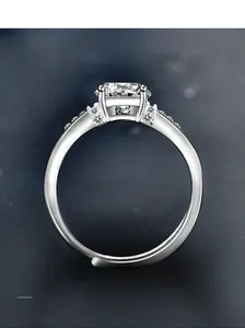 Macro shot of S925 silver ring featuring four-prong moissanite and adjustable band
